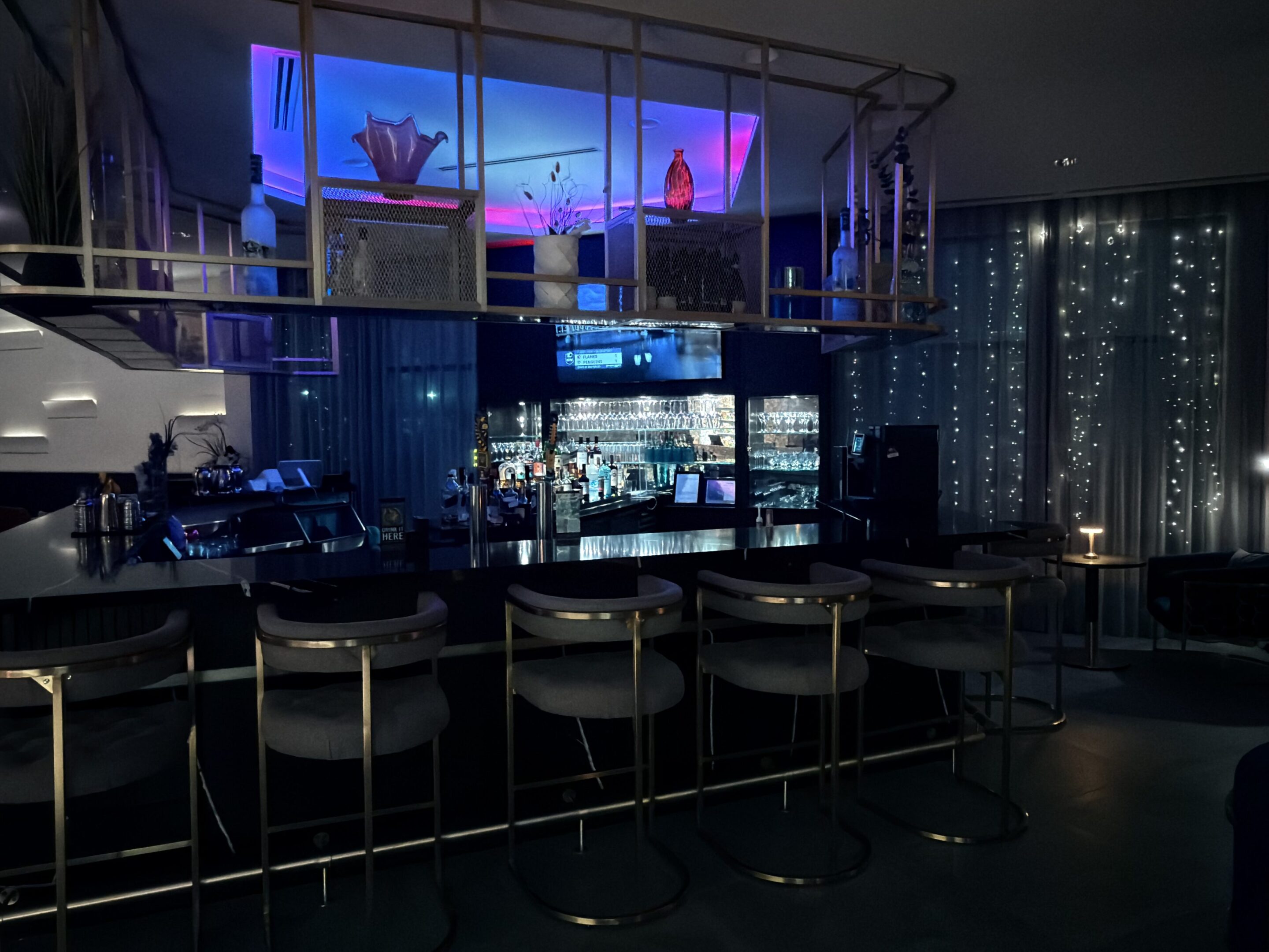 Stylish bar with illuminated shelves.