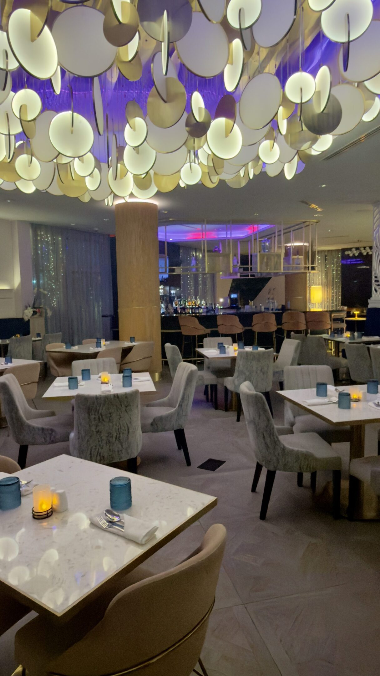 Modern restaurant interior with artistic ceiling