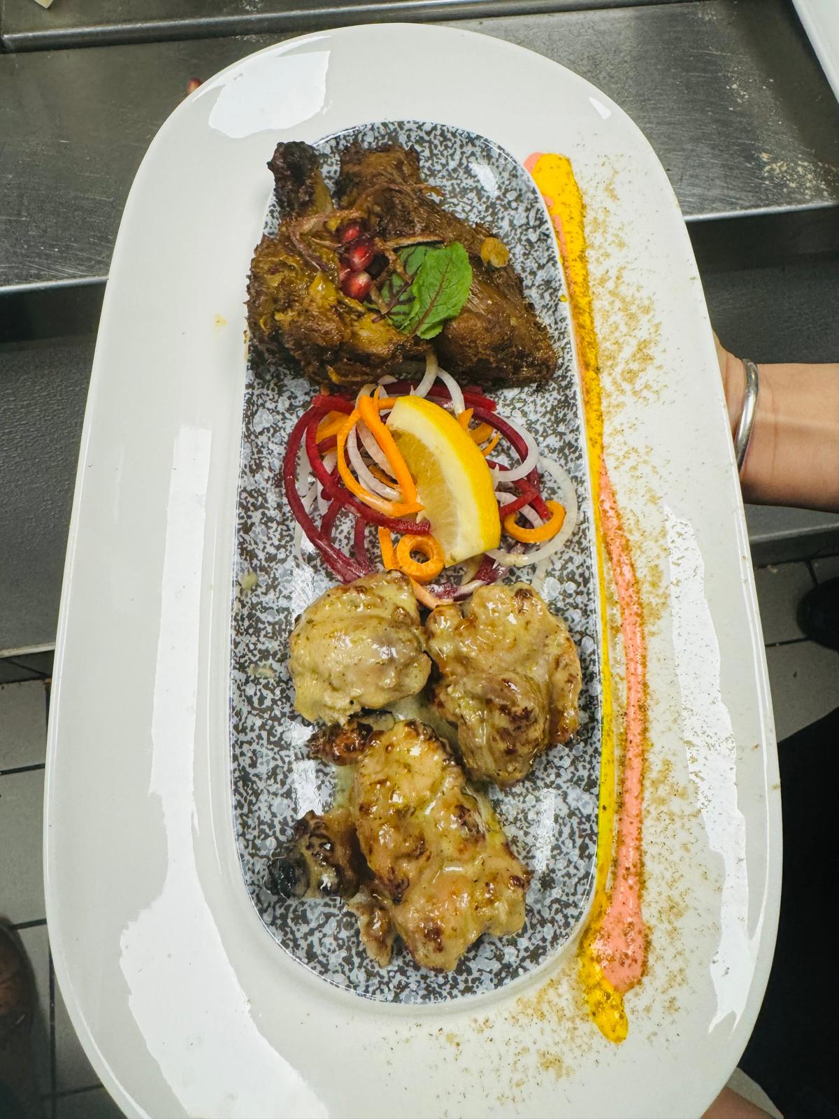 Elegant plated meat dish with garnish