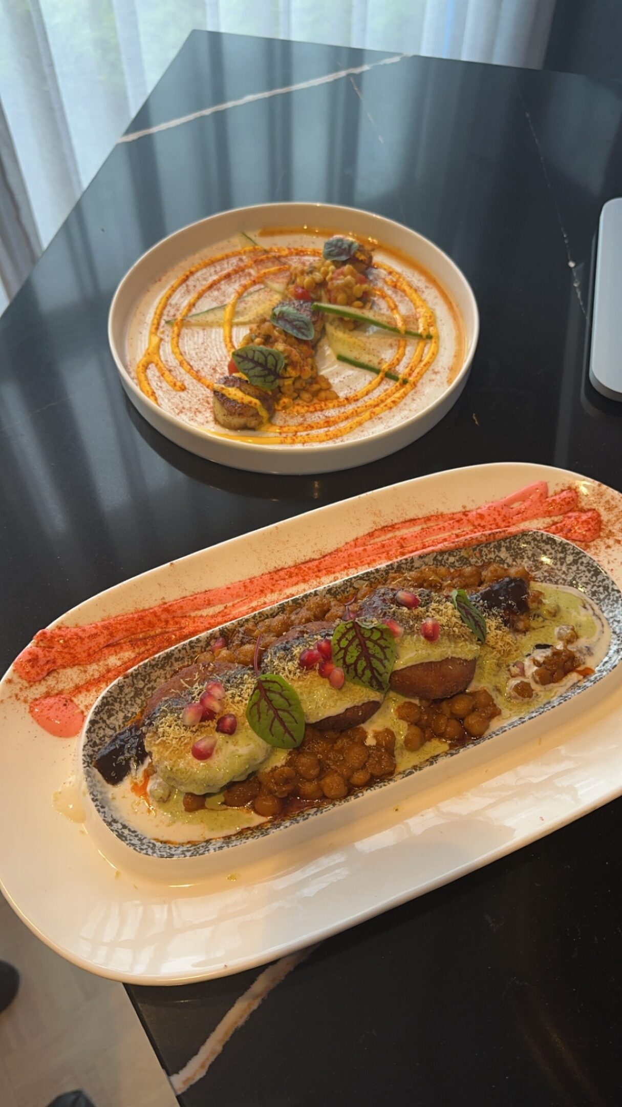 Gourmet dishes on black table