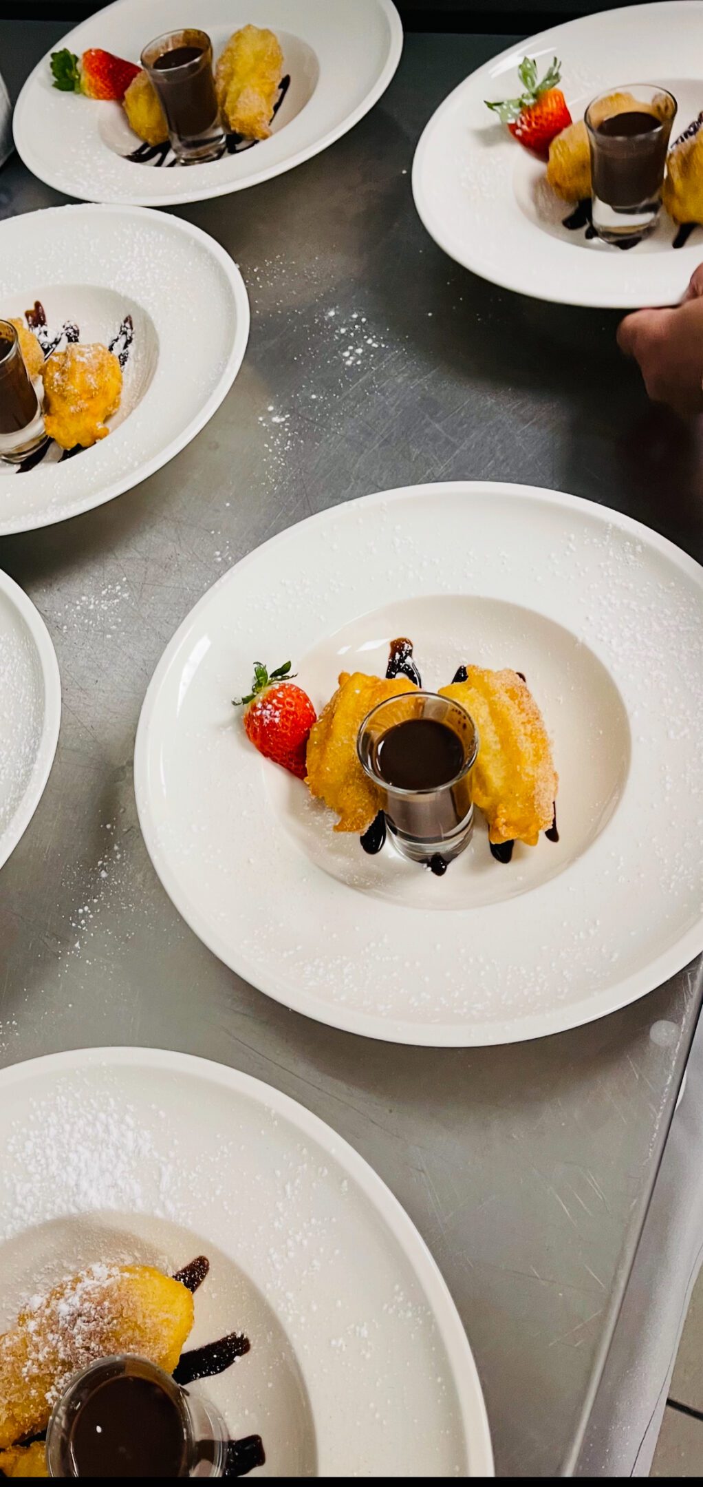 Gourmet dessert arrangement on white plates